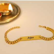 Load image into Gallery viewer, A Touch of Gold: Personalized Rakhi with Name Engraving (3.0)
