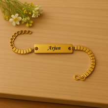 Load image into Gallery viewer, A Touch of Gold: Personalized Rakhi with Name Engraving (3.0)
